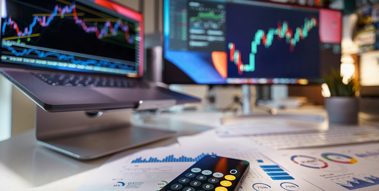 multiple screens with charts and data featured